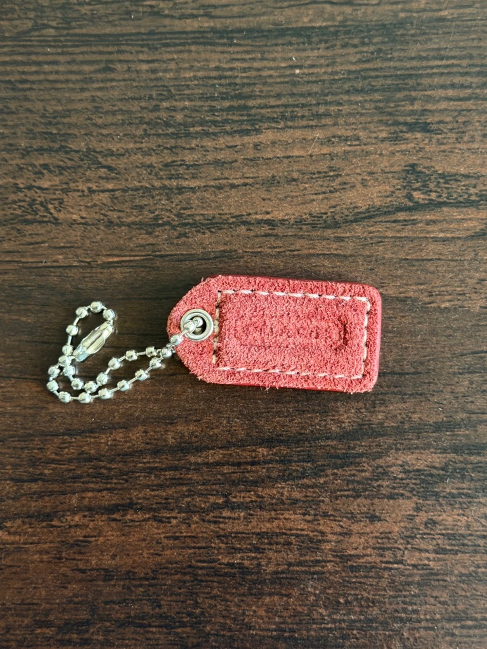 Coach suede/leather burgundy hangtag